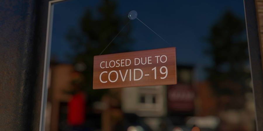sign warning saying closed due to Covid-19