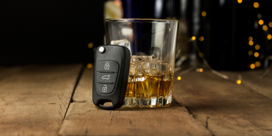 whiskey glass and car key