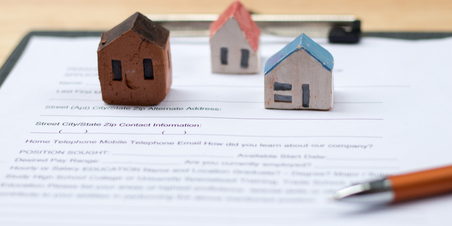 Tiny homes set on top of document pretending to be insured homes and insurance policy