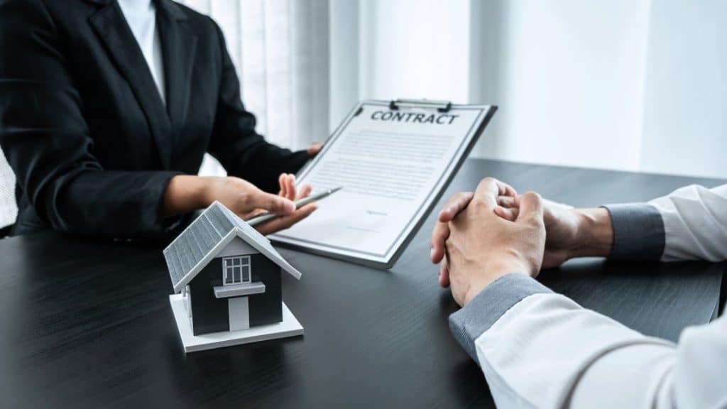 Agent and client reviewing a homeowners insurance policy