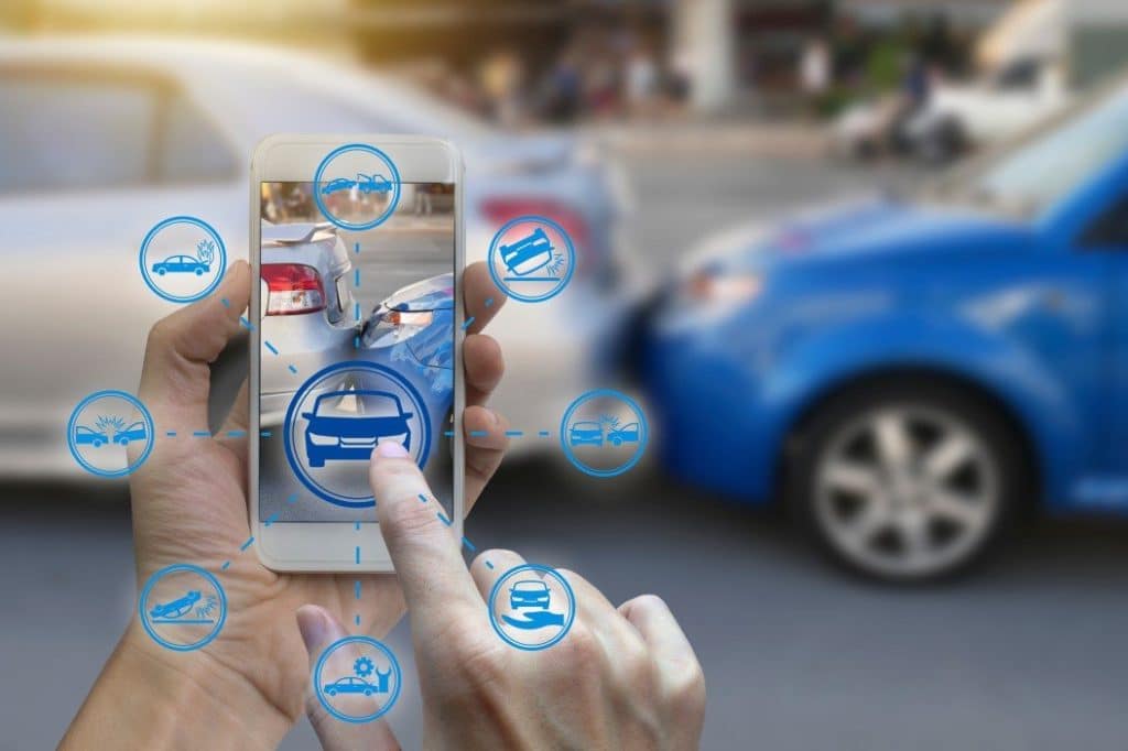 Person using phone application after car accident