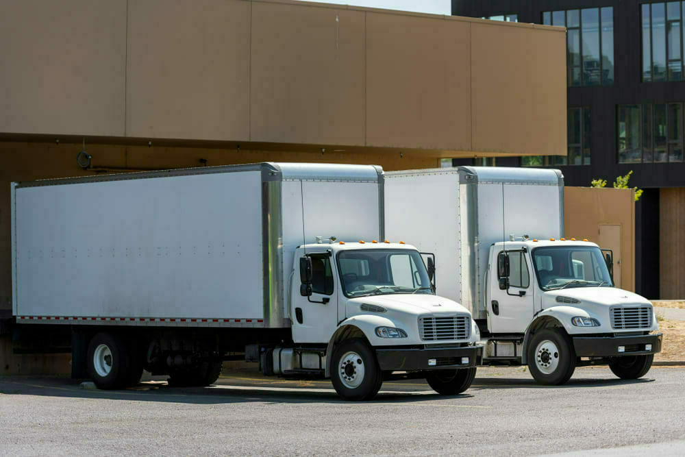 Pair of Relay Box trucks loading at the Amazon package facility