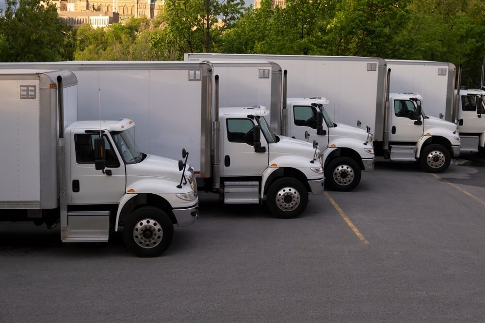 white box truck fleet lined up in a diagonal