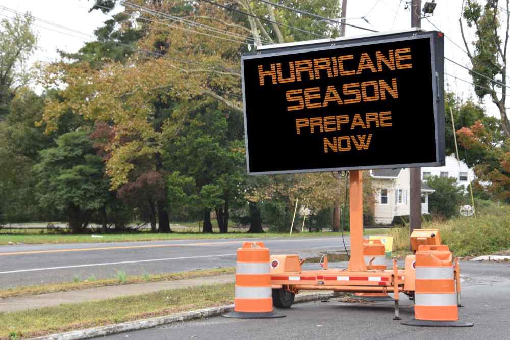 Electronic sign next to main road with warning reading Hurricane Season Prepare now
