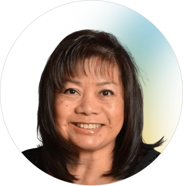 A professional headshot of a smiling, experienced woman with dark hair and bangs, representing the knowledgeable and reliable leadership team at Panorama Insurance.