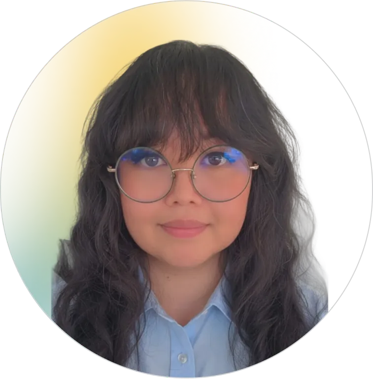 A professional headshot of a smiling young woman with dark wavy hair and round glasses, representing the helpful and accessible support team at Panorama Insurance.