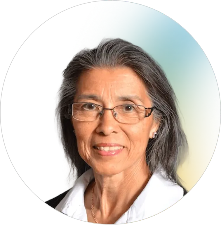 A professional headshot of a smiling senior woman with grey hair and glasses, representing the experienced and trustworthy team at Panorama Insurance.